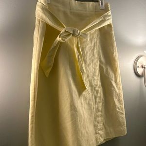 Creamy yellow mid length Ann Taylor skirt with ribbon tie